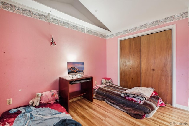 1340 Xanthia St, Denver, CO 80220 - bedroom with wood finished floors, lofted ceiling, and a closet
