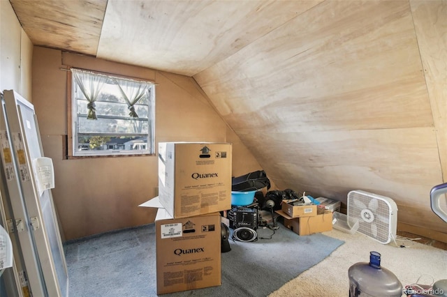 bonus room with carpet floors and vaulted ceiling