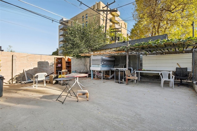 view of patio featuring a grill