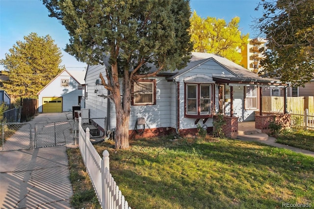 1340 Xanthia St, Denver, CO 80220 - bungalow-style house featuring a front yard, fence private yard, a gate, a detached garage, and an outdoor structure