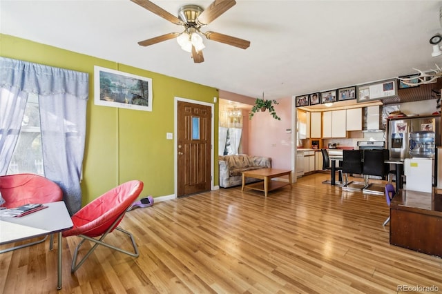 interior space with ceiling fan, light hardwood / wood-style flooring, and a wealth of natural light