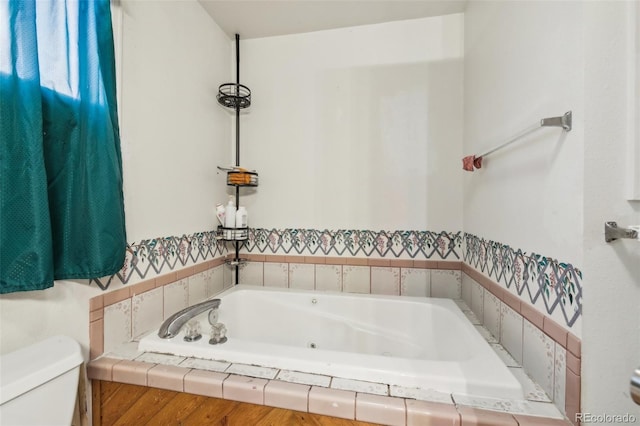 1340 Xanthia St, Denver, CO 80220 - full bathroom featuring a whirlpool tub and toilet