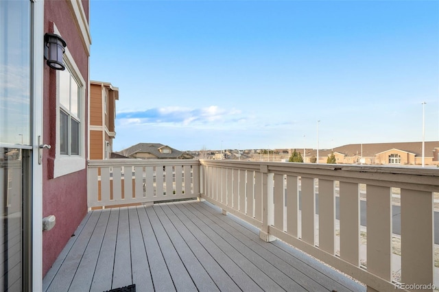 wooden terrace featuring a residential view