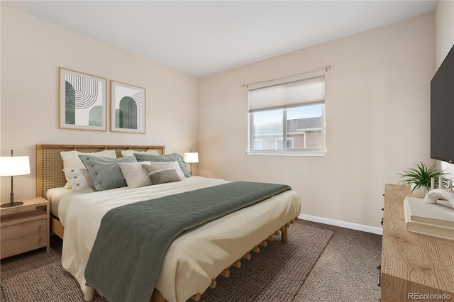 bedroom featuring carpet and baseboards