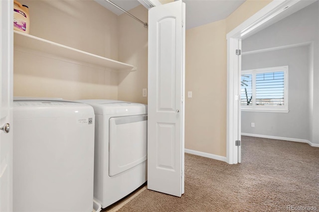 washroom featuring laundry area, light colored carpet, separate washer and dryer, and baseboards