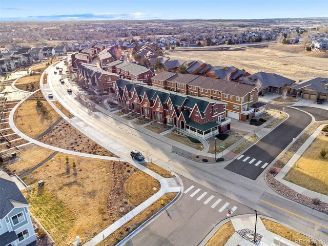 birds eye view of property with a residential view