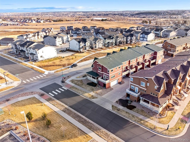 birds eye view of property with a residential view