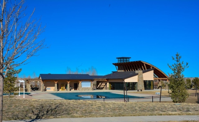 view of swimming pool with a patio area, a fenced in pool, and fence