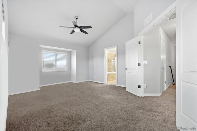 unfurnished bedroom with visible vents, baseboards, carpet, and vaulted ceiling