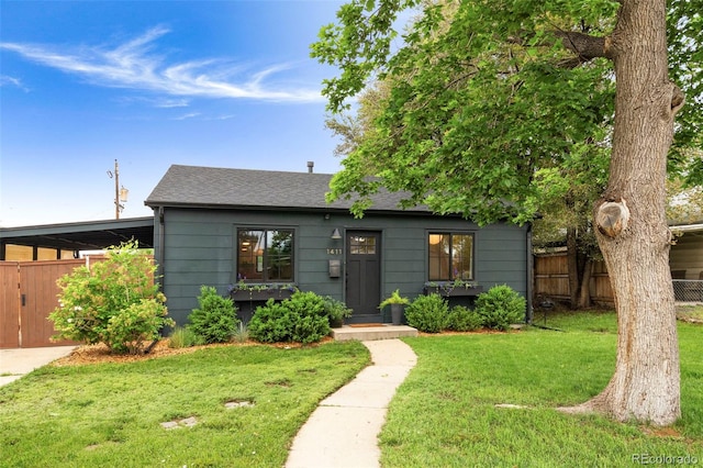 1411 S Beach Ct, Denver, CO 80219 - view of front facade featuring a shingled roof and a carport