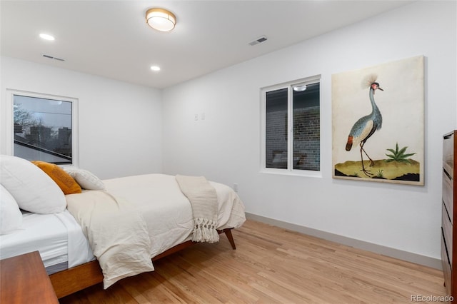 bedroom with light hardwood / wood-style flooring