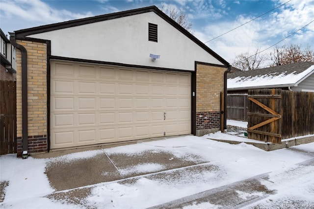 view of snow covered garage