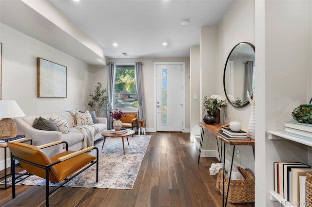 living room with dark hardwood / wood-style floors