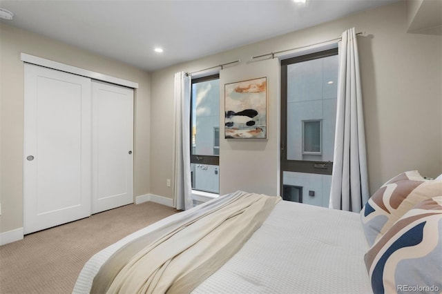 carpeted bedroom with a closet