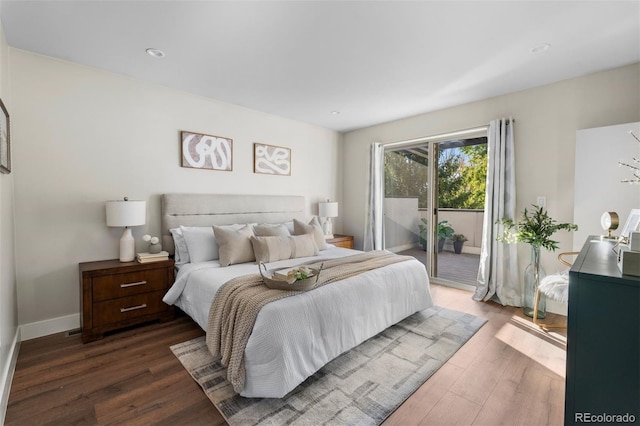 bedroom featuring access to exterior and dark hardwood / wood-style flooring