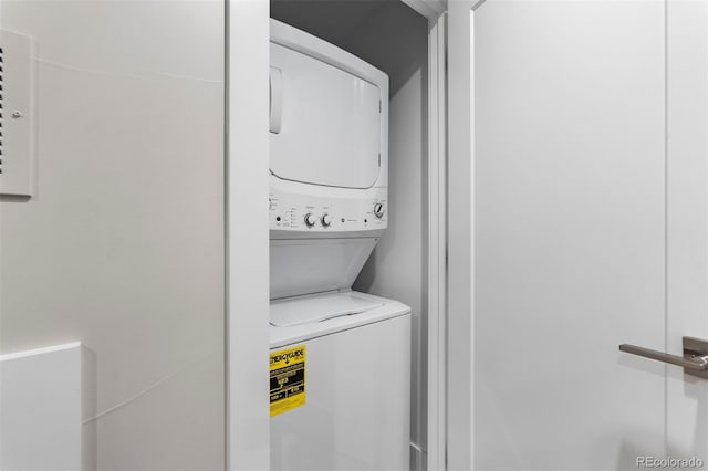 laundry room featuring stacked washer and dryer