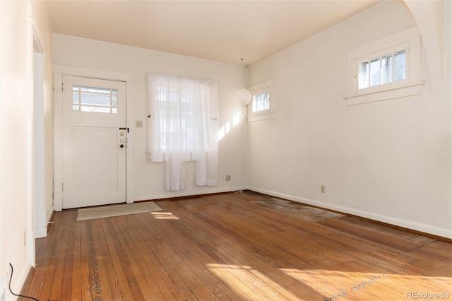 entryway featuring wood-type flooring and baseboards