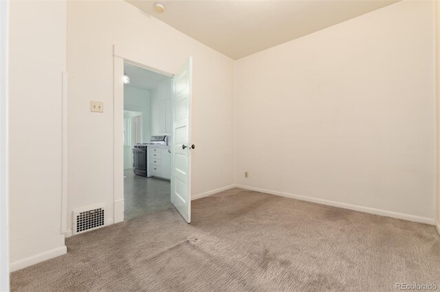 unfurnished room with baseboards, visible vents, and light colored carpet