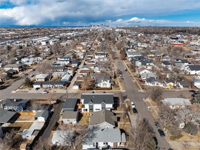 birds eye view of property with a residential view