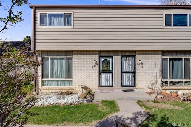 view of front of house with brick siding