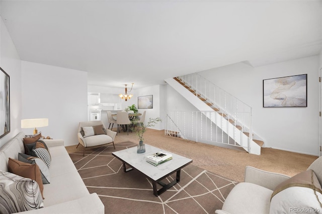 carpeted living room with an inviting chandelier and stairway