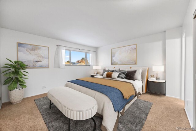 bedroom featuring baseboards and light colored carpet