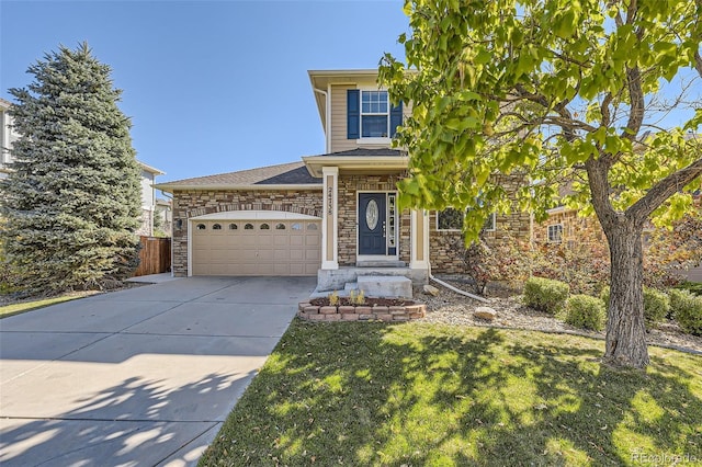 view of front of home with a front yard and a garage