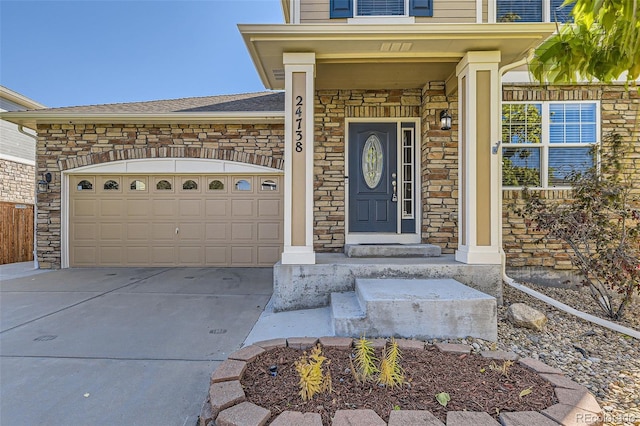 doorway to property with a garage