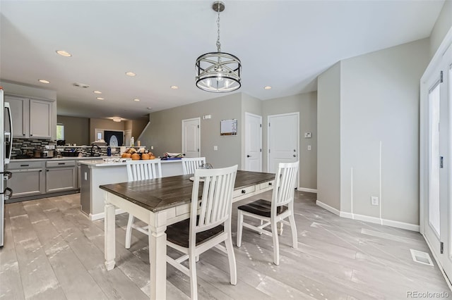 dining room featuring a notable chandelier