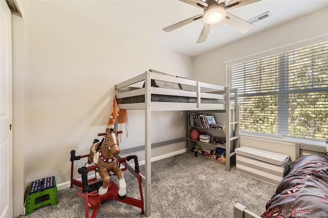 bedroom featuring carpet flooring, multiple windows, and ceiling fan