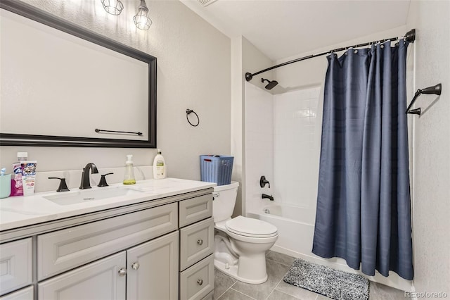 full bathroom with vanity, toilet, tile patterned floors, and shower / tub combo