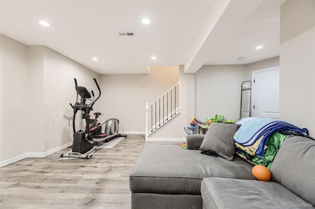 workout room featuring light hardwood / wood-style floors