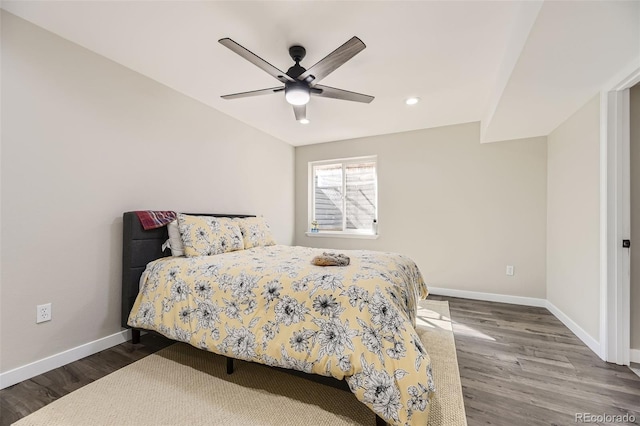 bedroom featuring ceiling fan and hardwood / wood-style flooring