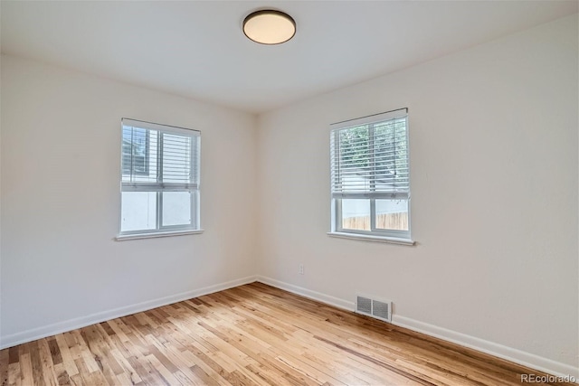 unfurnished room featuring light hardwood / wood-style flooring