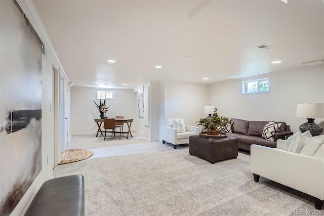 carpeted living room with a healthy amount of sunlight