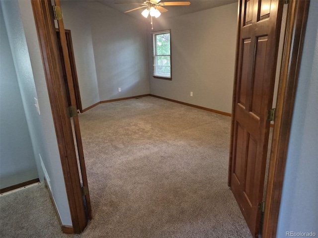 2477 S Oakland Cir, Aurora, CO 80014 - spare room with light colored carpet, ceiling fan, and baseboards
