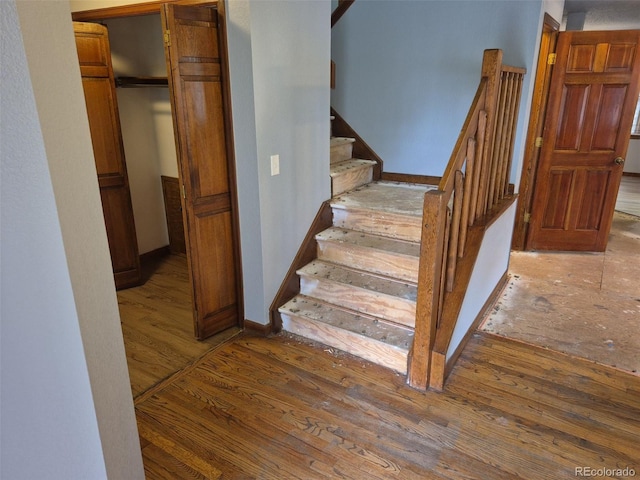 2477 S Oakland Cir, Aurora, CO 80014 - stairs with wood finished floors and baseboards