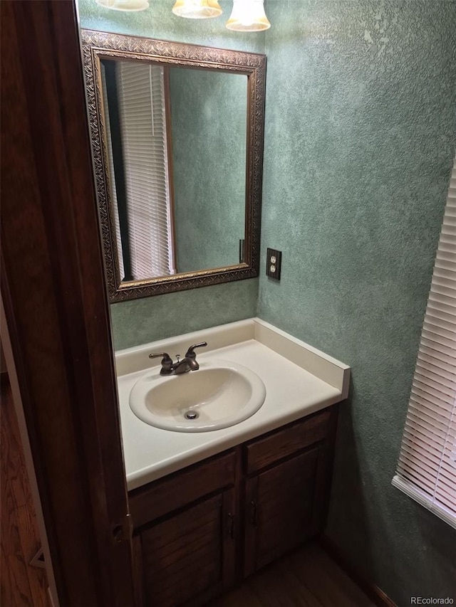 2477 S Oakland Cir, Aurora, CO 80014 - bathroom featuring vanity and a textured wall