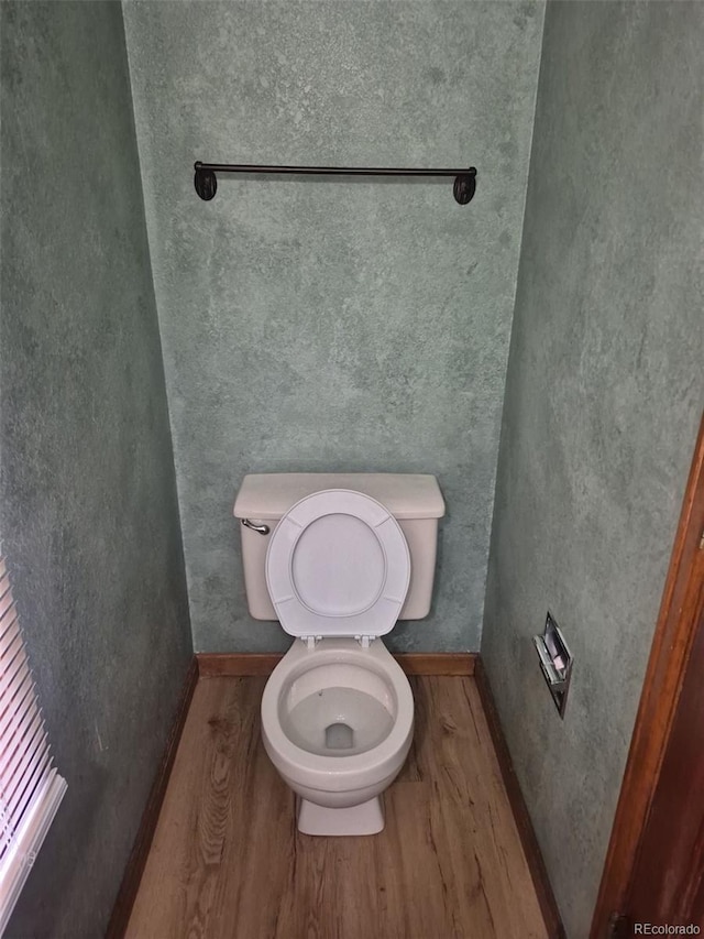 2477 S Oakland Cir, Aurora, CO 80014 - bathroom with toilet and wood finished floors