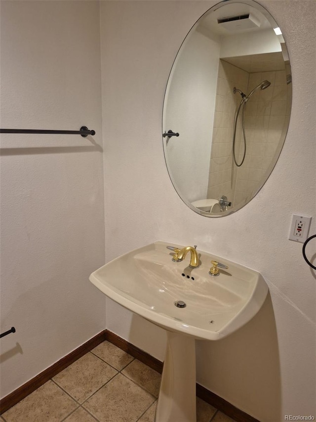 2477 S Oakland Cir, Aurora, CO 80014 - bathroom featuring tile patterned floors, a sink, and baseboards
