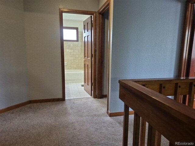 2477 S Oakland Cir, Aurora, CO 80014 - hall featuring carpet floors, baseboards, and a textured wall