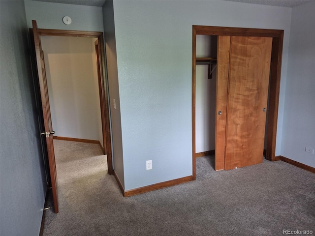 2477 S Oakland Cir, Aurora, CO 80014 - unfurnished bedroom with carpet flooring, baseboards, and a closet