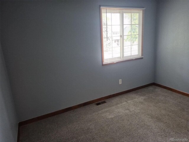 2477 S Oakland Cir, Aurora, CO 80014 - carpeted empty room with baseboards