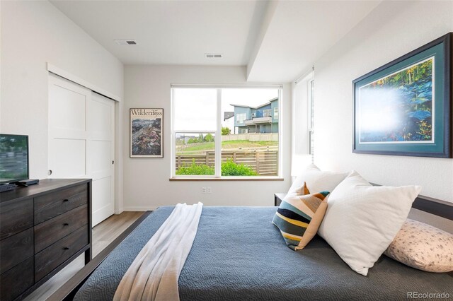 928 Cimarron Dr Unit C, Lafayette, CO 80026 - bedroom featuring wood finished floors and baseboards