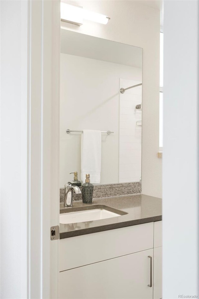 928 Cimarron Dr Unit C, Lafayette, CO 80026 - bathroom with vanity and a shower