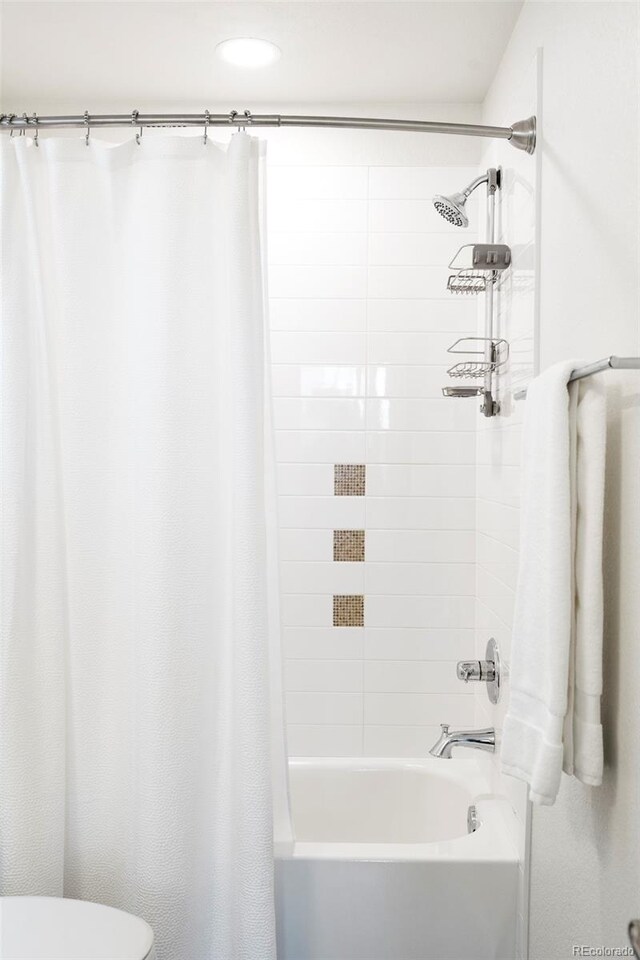 928 Cimarron Dr Unit C, Lafayette, CO 80026 - full bath featuring shower / tub combo with curtain and toilet
