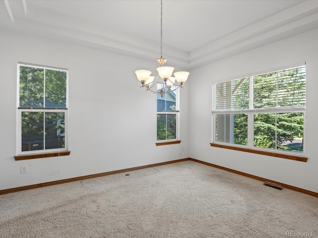 7254 S Kellerman Way, Aurora, CO 80016 - empty room featuring carpet flooring, a chandelier, and a tray ceiling