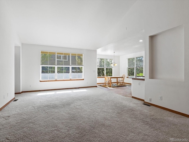 7254 S Kellerman Way, Aurora, CO 80016 - empty room featuring carpet flooring and a chandelier