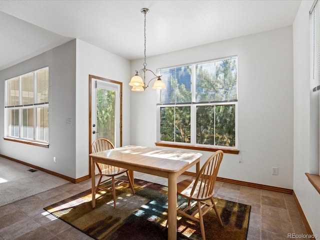 7254 S Kellerman Way, Aurora, CO 80016 - dining space with a chandelier and baseboards