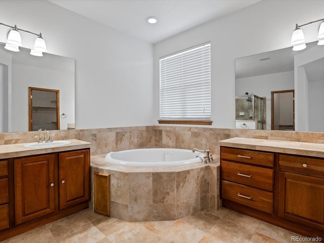 7254 S Kellerman Way, Aurora, CO 80016 - bathroom featuring a stall shower, two vanities, a bath, and tile patterned floors